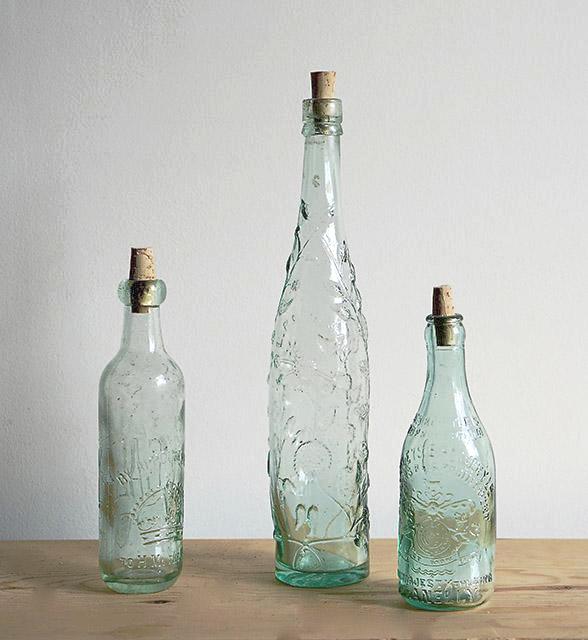 Three gorgeous antique glass stoppered bottles, one from each part of Great Britain.