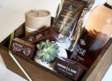 Luxury gift box containing handmade organic chocolate truffles and fudge, a hand poured soy organic candle, a bottle of rose wine from Byron Blatty wines and a Foxgloves & Folly flower jar or succulent pot 