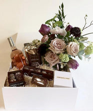 Luxury gift box containing handmade organic chocolate truffles and fudge, a hand poured soy organic candle, a bottle of rose wine from Byron Blatty wines and a Foxgloves & Folly flower jar or succulent pot  