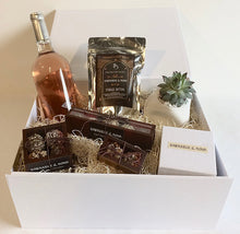Luxury gift box containing handmade organic chocolate truffles and fudge, a hand poured soy organic candle, a bottle of rose wine from Byron Blatty wines and a Foxgloves & Folly flower jar or succulent pot 