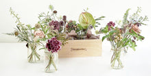 A selection of seasonal flowers set in either 4 or 6 jam jars and contained in a handmade wooden box.