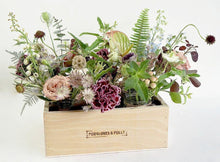 A selection of seasonal flowers set in either 4 or 6 jam jars and contained in a handmade wooden box.